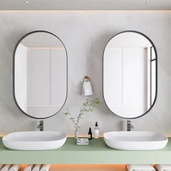 Armoire à miroir ovale noire avec cadre métal, meuble mural avec étagères réglables, rangement salle de bain