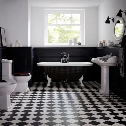 Baignoire ilot Charly ovale noire et blanche avec piétements blanc
