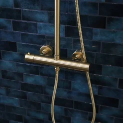 Colonne de douche thermostatique corps froid or brossé Essebagno Delice II