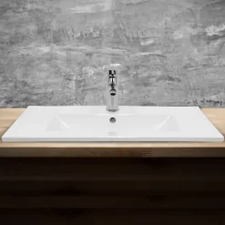 Lavabo en céramique blanc avec garniture de vidage et trop-plein 710x465x175 mm