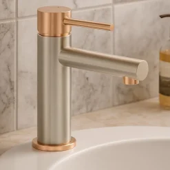 Mitigeur lavabo bas façon inox et or rose Essebagno Envol